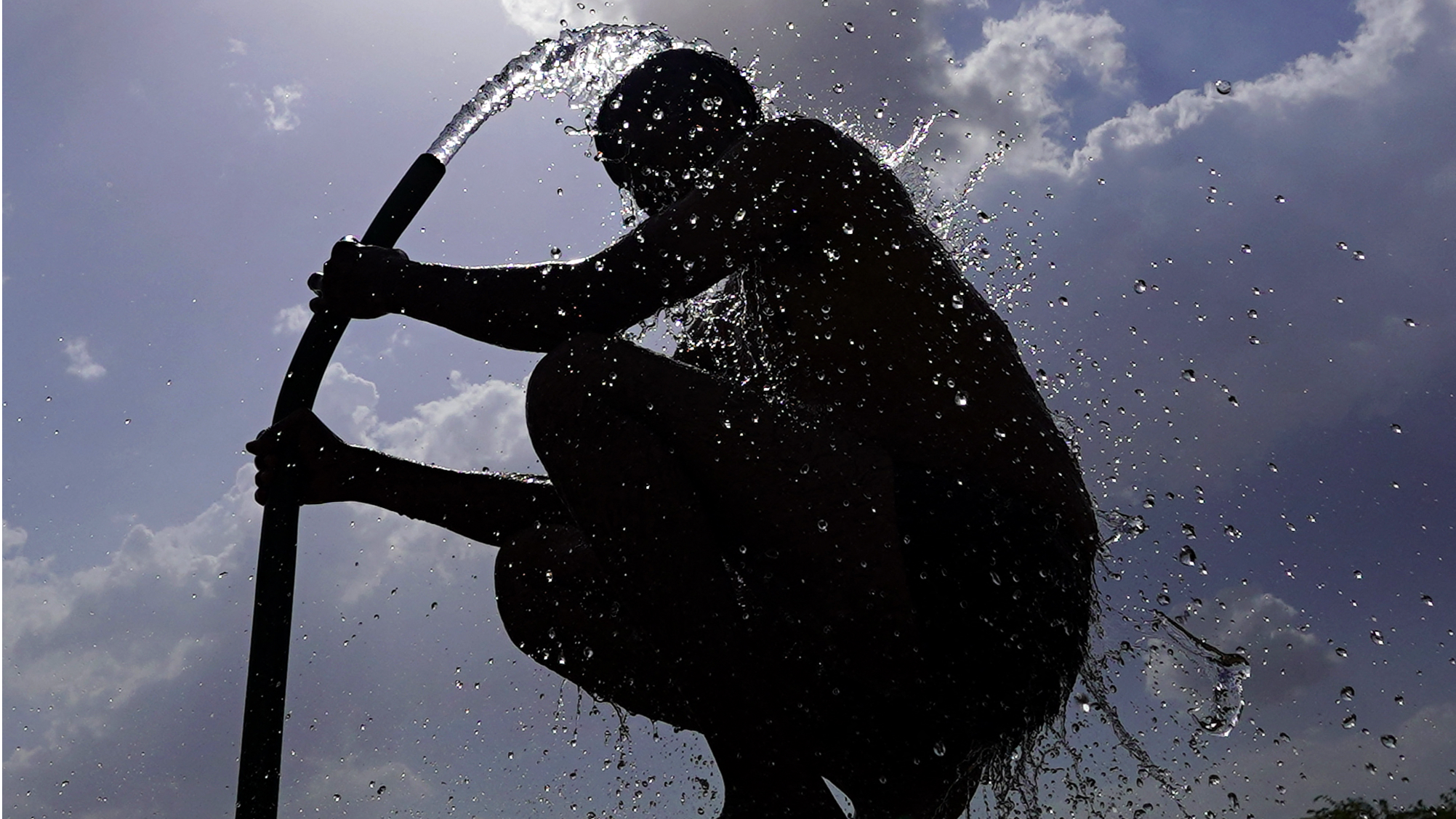 Millions sweltering under extreme heat worldwide as summer arrives